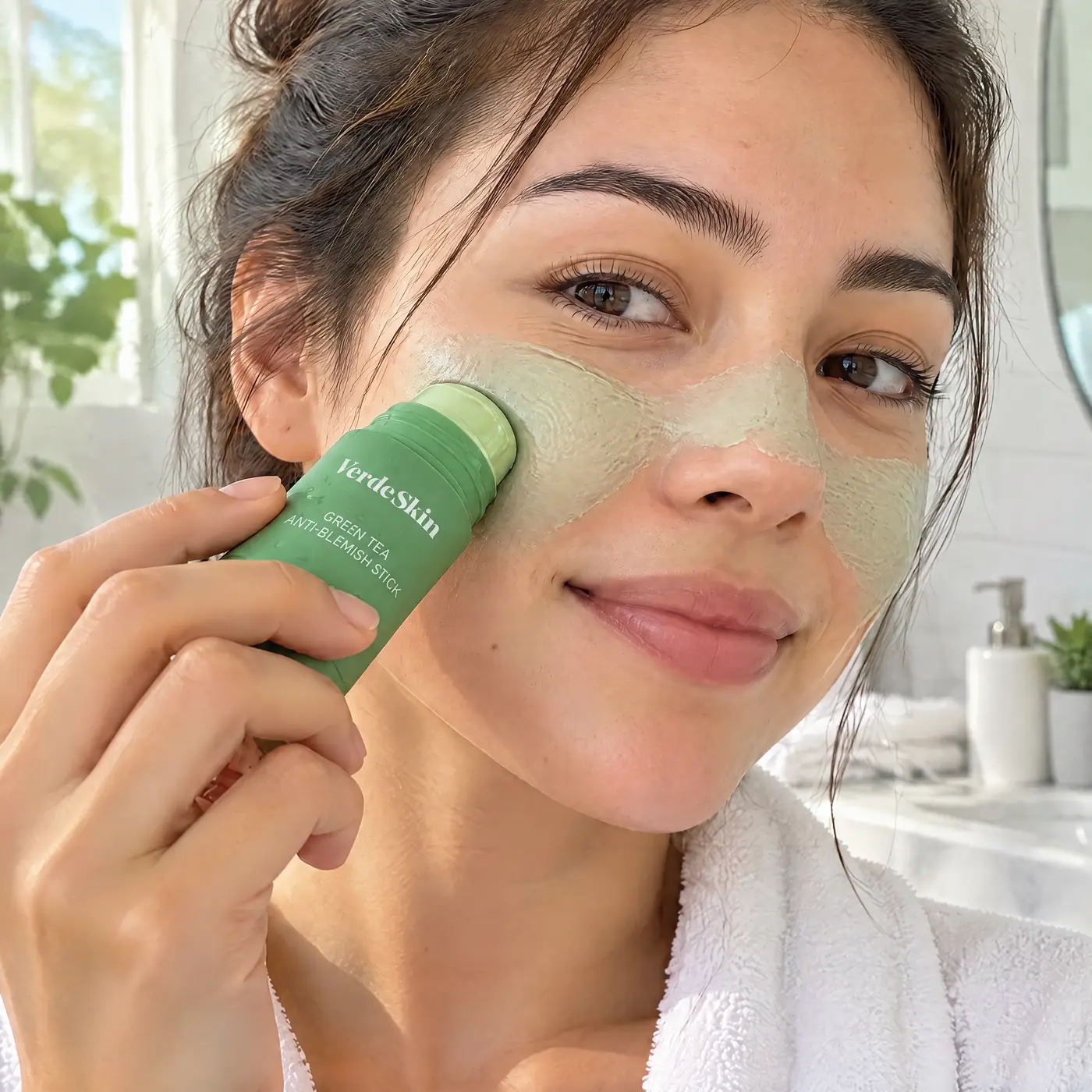 Woman swiping the VerdeSkin stick across her cheek